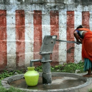 Kanchi, India - Woman at Waterpump