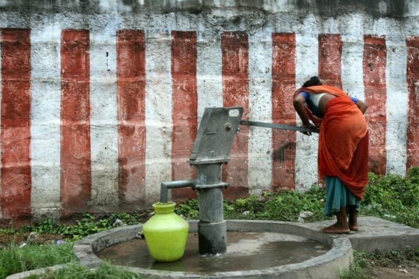 Kanchi, India - Woman at Waterpump